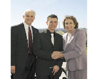 Zach Guill is flanked by Rep. Dave Reichert and Speaker of the House Nancy Pelosi in Washington