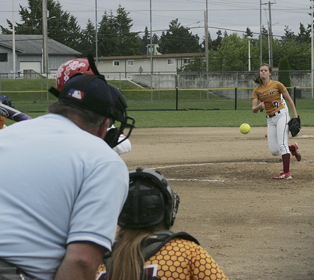 Kayla Smith throws a fastball at the 2015 district championship Saturday.