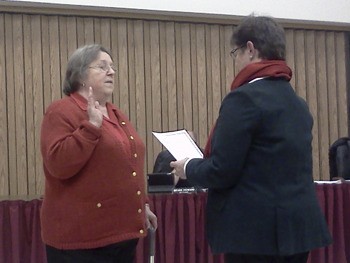 Nora Lyn Rose takes the oath of office administered by Mayor Pat Johnson.