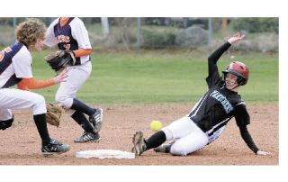 Jacqui Beal slides safe at second before the ball reaches the Lakes shortshop.