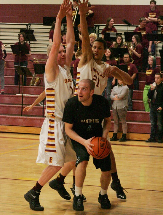 Senior Jacob Zahnow goes up for a layup while double teamed Friday against Enumclaw.