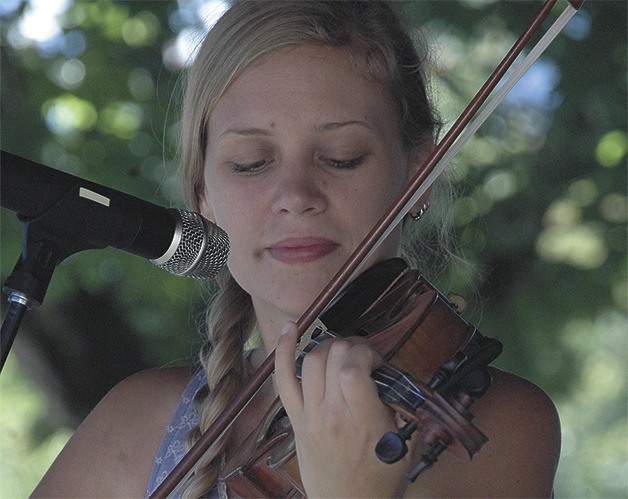 Rachel Erin Sage from the duo Summer Januaries performed Friday at the Enumclaw Street Fair.