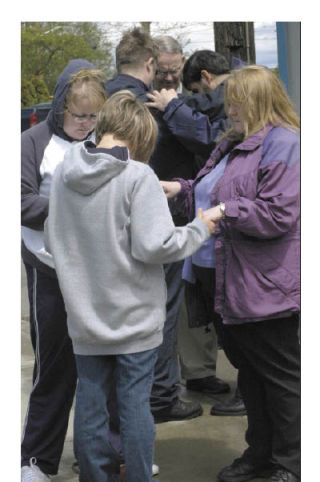 Several women pray together during Thursday’s National Day of Prayer in Allan Yorke Park. Mike Keith