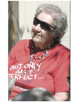 LaVerna Waller sits and listens to live music Thursday under sunny skies at the Bonney Lake Senior Center. The senior celebrated the Fourth of July with an Elvis impersonator and barbecue.