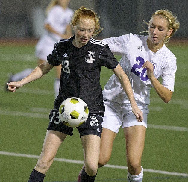 Rachel Stowell (right) defends against Bonney Lake during the rivalry game this season.