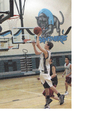 Bonney Lake’s Chad Purdue goes up for an uncontested bucket during a game last season.