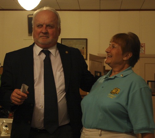 Sumner Lions Club President Sandy Nolen presents Dan Comsia with the check financing seven Project New Hope families.