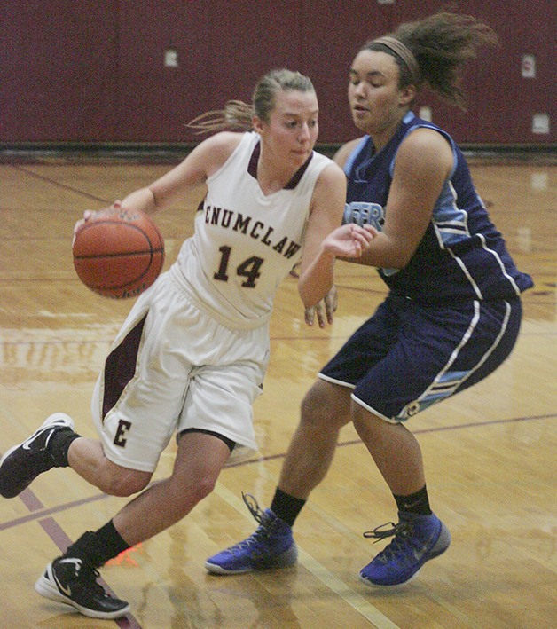 Enumclaw captain Kimmy Aubert drives against a Rogers High defender during Saturday afternoon’s jamboree at White River. Aubert and her teammates