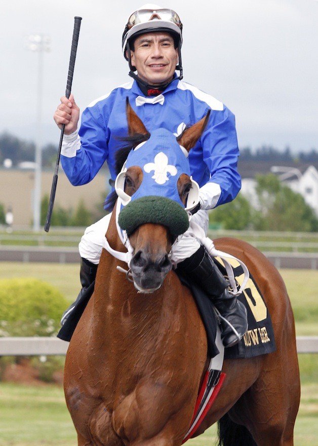 Javier Matias is all smiles after guiding Fleur De Lis Stables Winning Machine to a victory in the 2012 Budweiser Handicap at Emerald Downs. The two veterans--Winning Machine & Matias--team up again Sunday in the $50
