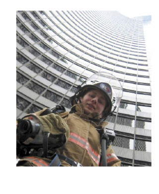 Fireman Matt Reinke stands in front of the Columbia Center Towers.