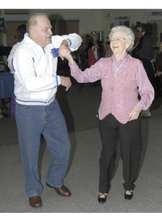 Miles Purves dances with Fran Gidwell Saturday at the Bonney Lake Senior Center. Both are residents of the Cedar Ridge Retirement and Assisted Living Community.
