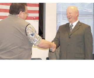 Jerry Thorson (right) was sworn in Feb. 27 as the new East Pierce Fire Chief by Rick Kuss