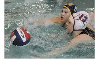 Enumclaw’s Erin Stucker and Sumner’s Stephanie Hamre battle for a loose ball during water polo action March 11.