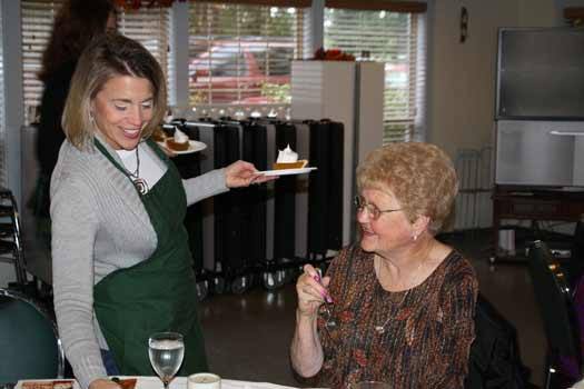 Victor Fall Elementary School Principal Beth Dykman serves a slice of pie to Evelyn Rooker during the Bonney Lake Senior Center's annual Thanksgiving feast Nov. 18 at the Senior Center.