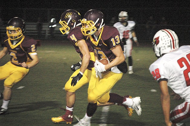 Dustin France looks for additional yardage after catching a pass during White River’s Friday night victory.