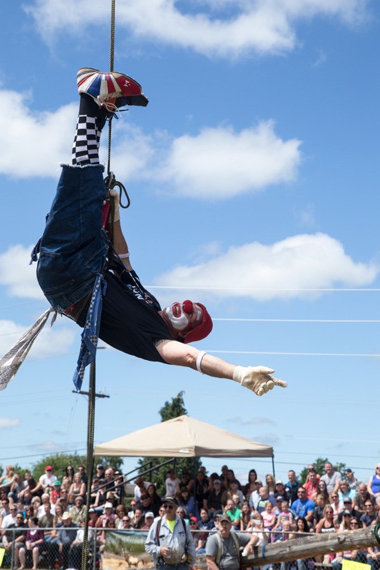 Timbrr the Clown performs some mid-air acrobatics for the crowd at the 2016 Buckley Log Show.