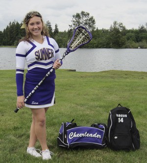 Sara Vargus poses with her lacrosse gear near her Tapps Island home.