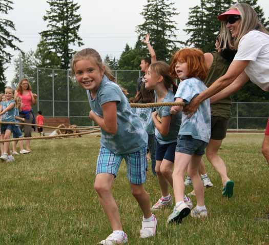 First-grader Shealyn S. gives it her all during a tug-of-war at Lake Tapps Elementary School Field Day