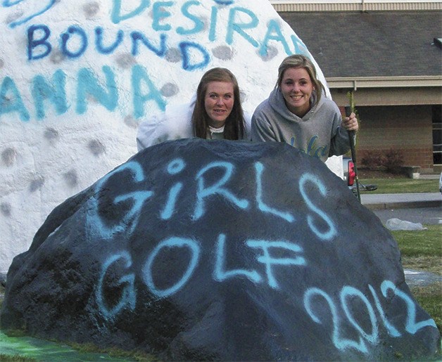 Anna Babbitt and Desirae Haselwood decorated the graffitti rock at Bonney Lake High School last year when they qualified for the WIAA state tournament.