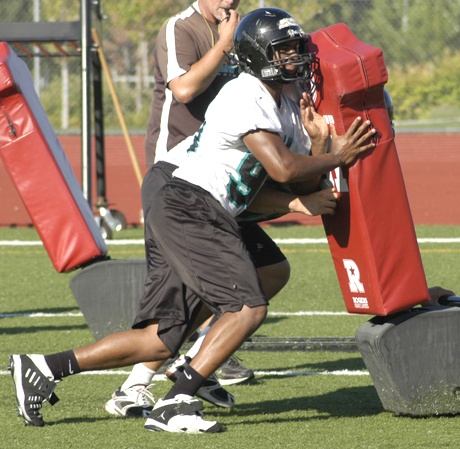 A pair of Bonney Lake High football players participate in blocking drills the first day of fall practice Wednesday