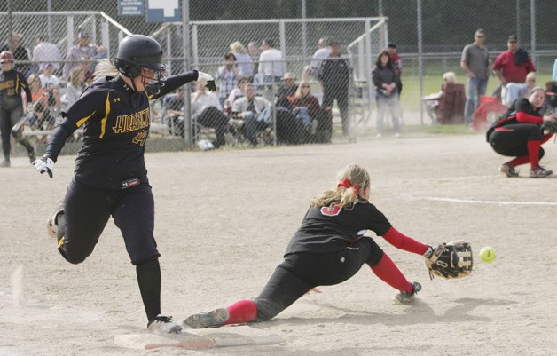 Anna DeGroot is safe at first in the game against Yelm Friday at the district tournament.