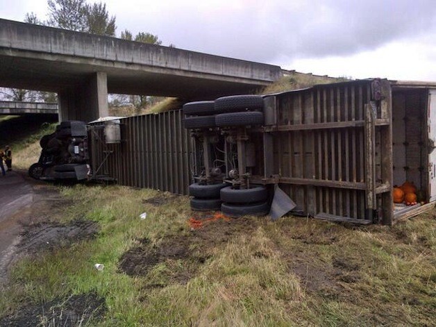 Semi collision state Route 167 on the ramp to EB SR-410. Traffic is still getting by.