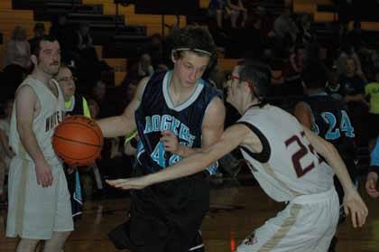 White River's Jon King lays some heavy defense on a Ram from Rogers during the first Slam the Stands event Jan. 25.
