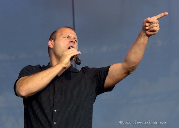 Daron Wolschleger singing onstage with The Beatniks
