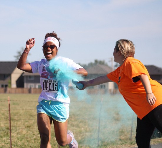 More than 2000 runners braved the heat Saturday and signed up to run in the Win Me 5K Color Run. Throughout the course