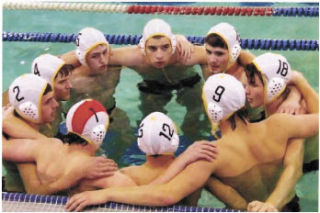 The Enumclaw High School boys water polo team put their heads together during play this fall.