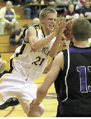 Wes Caldwell trys to get his hands on the ball as he weaves  between North Thurston defenders.