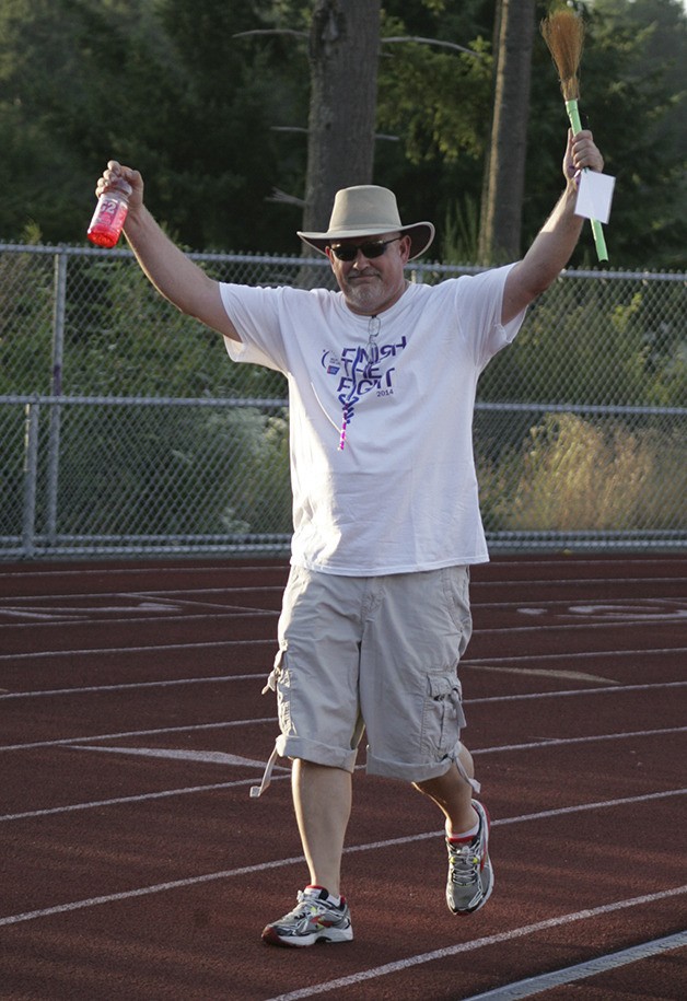 Greg Robbins walked the track at Bonney Lake High School Friday evening during the 2014 Relay for Life.