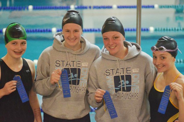 The Enumclaw girls swim and dive Bailey Sexton (back stroke)