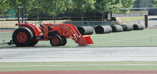 Crews were removing the turf last week on the White River High campus. The same goal