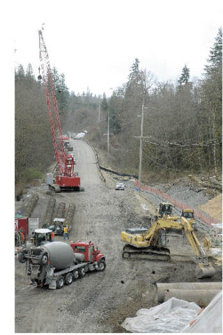 Work crews have been busy reinforcing the east slope of the Kummer Bridge between Enumclaw and Black Diamond. Ancient    geology and the winter’s heavy rains convinced the state’s Department of Transportation to close the span for safety reasons. For all the details