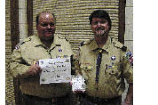 Wayne Hathaway  presents Bill Johnson with the Pack of the Year award.