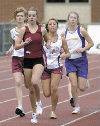 White River’s Lauryn Wate  and Ashley Llapitan  competed in the 800-meter run Saturday at Sunset  Chev Stadium in  Sumner. The Spartans  hosted the preseason  jamboree