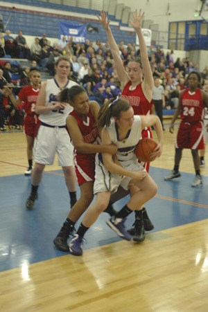 Nicole Miller wrests the ball away from a Renton player.