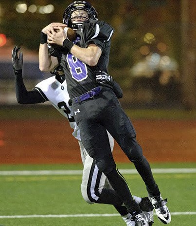 Sumner senior Scott Allsop makes a leaping grab during the rivalry game at Sunset Chev Stadium.