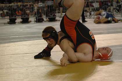 WRHS's Chris Skinner sticks his Centralia opponent during 2A state wrestling action Thursday.