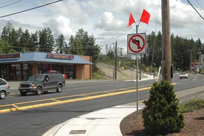 Despite signage and a new c-curb at the intersection of state Route 410 and 182nd Avenue East