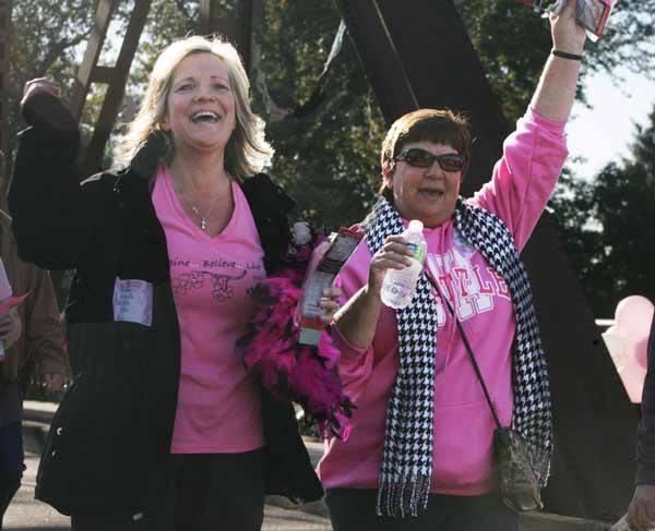 Robyn Martin and Laurie Christina cheer during the annual Come Walk With Me 5K and fundraiser.