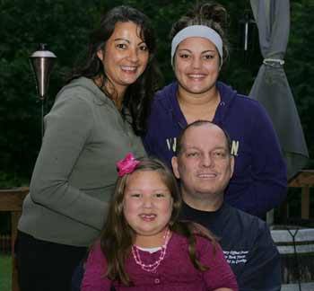 Mayor Neil Johnson poses with his wife MaryAnn and daughters Rendi