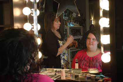 Bonney Lake High School senior Kristina Olivares gets primped by Colleen West April 30 at the Backstage Salon in Buckley.