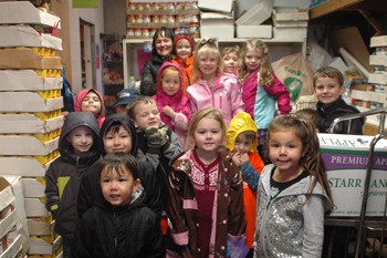 Students from Peak Preschool pose at the Food Bank with their donations.