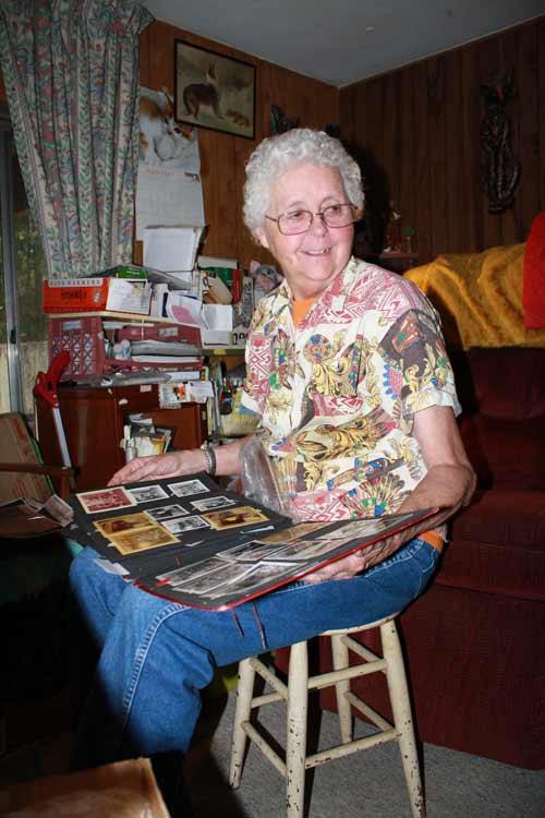 Bonney Lake Resident Joan Rupp looks through her scrapbook from her time as a professional basketball player int he 1950s.