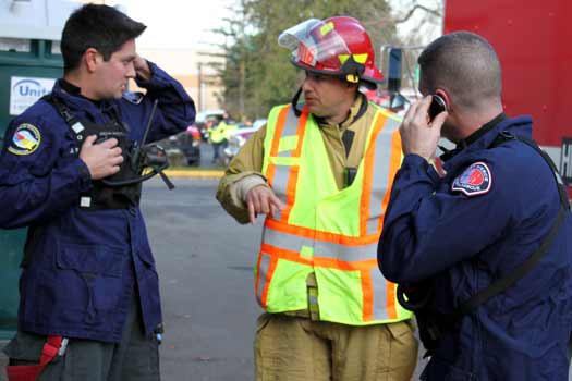 Members of East Pierce Fire and Rescue coordinate their response during a hazardous materials situation in Sumner Dec. 13.