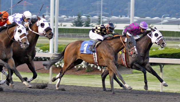 Rezar (No. 3) and jockey Javier Matias prevail in a close finish in the feature race for 3-year-olds and up at Emerald Downs. The 4-year-old Kentucky-bred gelding by Songandaprayer ran six furliongs in 1:08.57. July 6