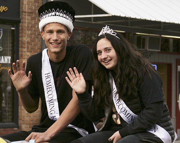 Enumclaw homecoming king and queen lead the downtown parade.