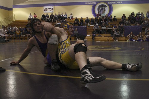 The Spartans' Nick Hultberg jockeys for control of Allen Richards' arms during their tense match up at Sumner High School Thursday. Richards unwisely gave up his left arm under Hultberg's body weight